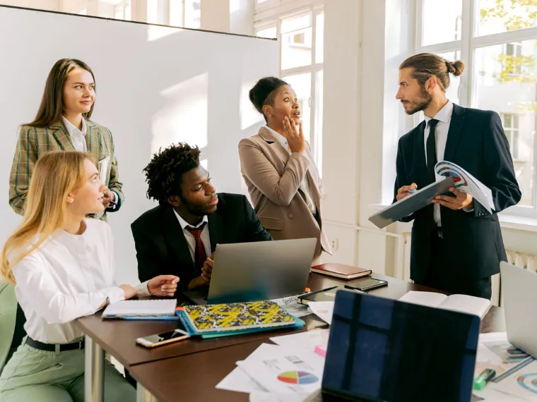 A professional team working around a table